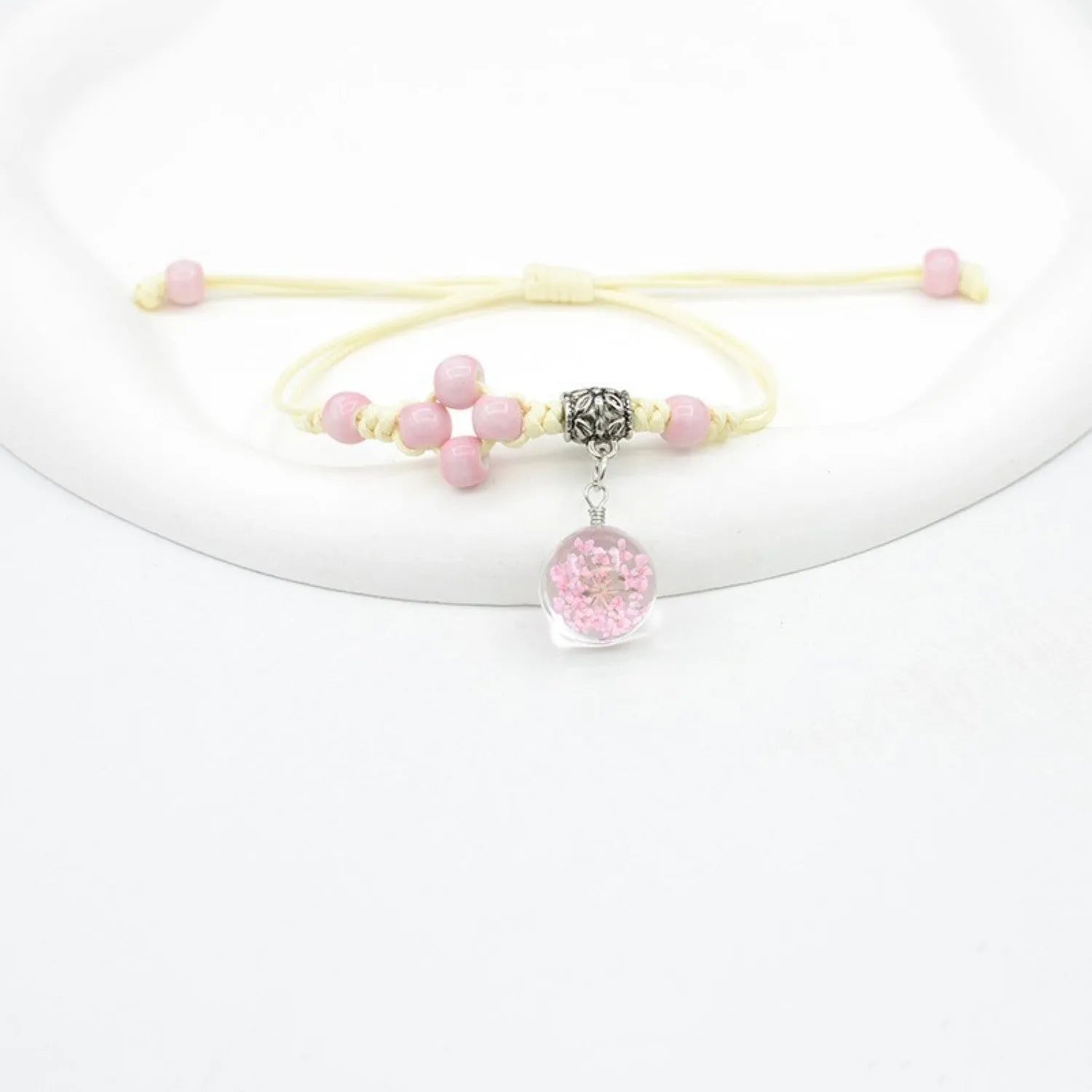 Glass dried flower bracelet with large 1.4cm beads containing real preserved flowers in hand-woven design