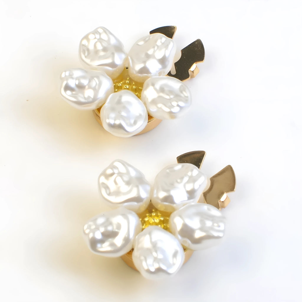 White alloy pearl rhinestone cufflink with electroplated finish and inlaid diamond setting on solid background