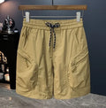 Man wearing loose-fit camouflage cargo shorts made from a cotton blend fabric.