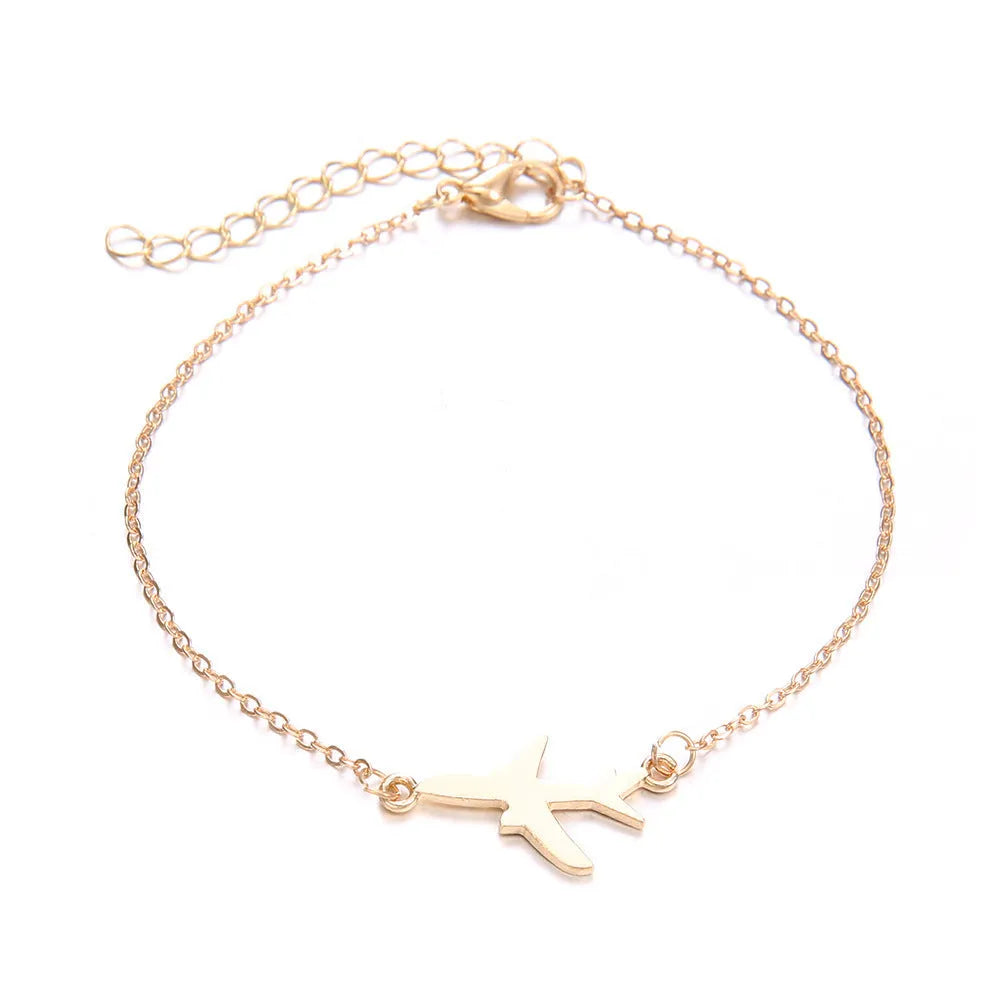Three silver-tone alloy bracelets with heart-shaped charms featuring aircraft and map designs.