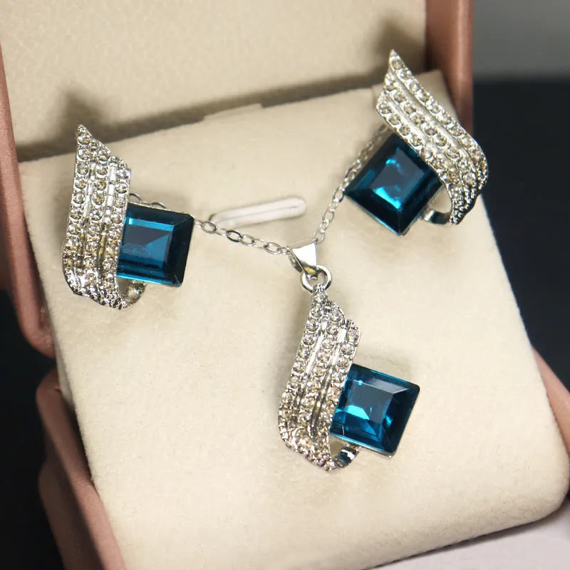Women's necklace and earring set with glass pendant on cross chain, electroplated finish
