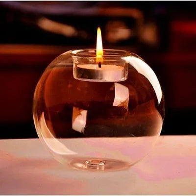 Handmade round transparent glass candle holder showing hollow centre for a candle