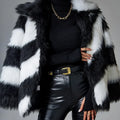 Minimalist women's faux fur coat with contrast colour lapel and a detachable fur collar.