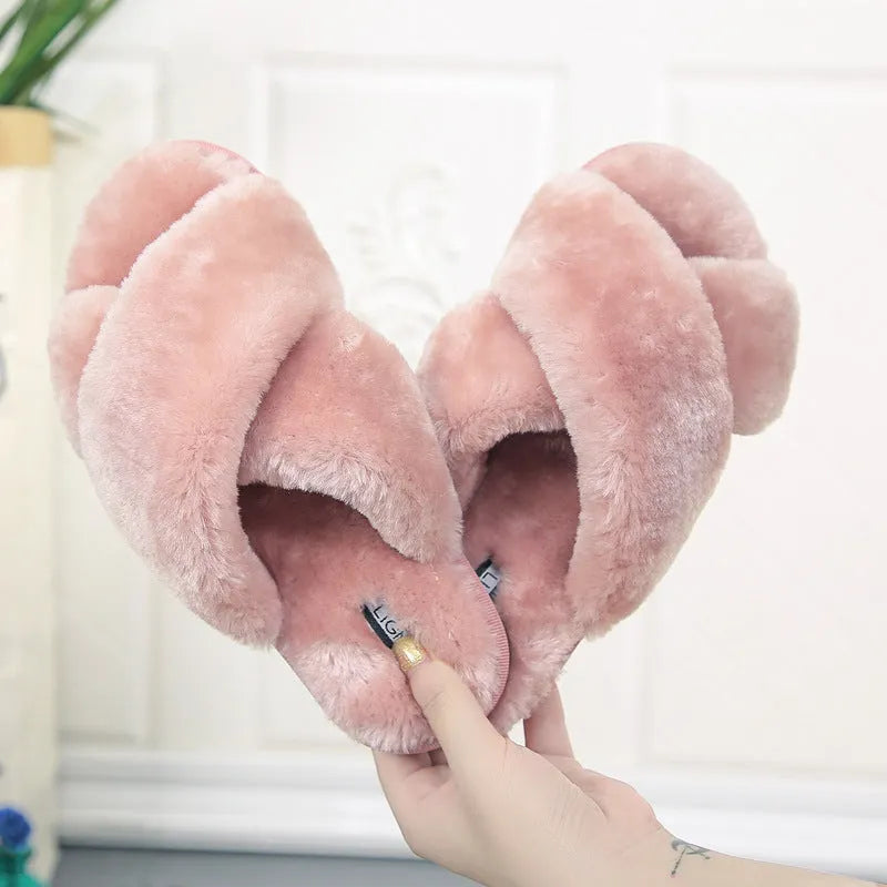 Women's cross open-toe fur slippers in black showing non-slip sole pattern