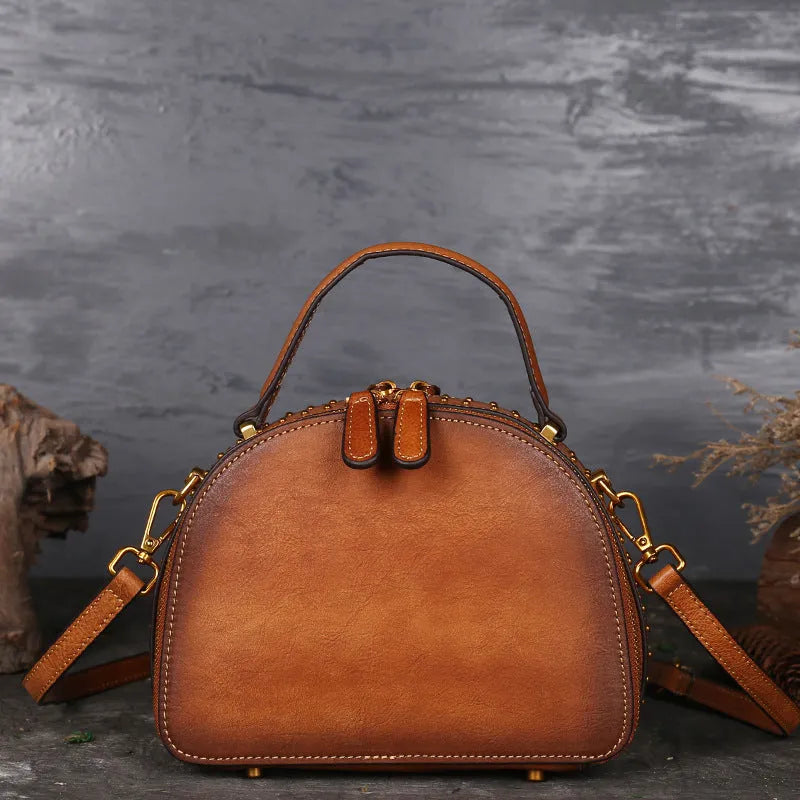 Vintage cowhide leather handbag with suede accents showing interior compartments including ID bag and mobile phone pocket