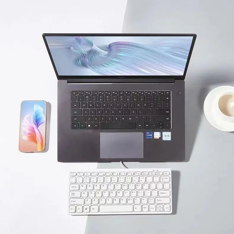 Mini wired USB computer keyboard in black, white, pink, or blue colour options.