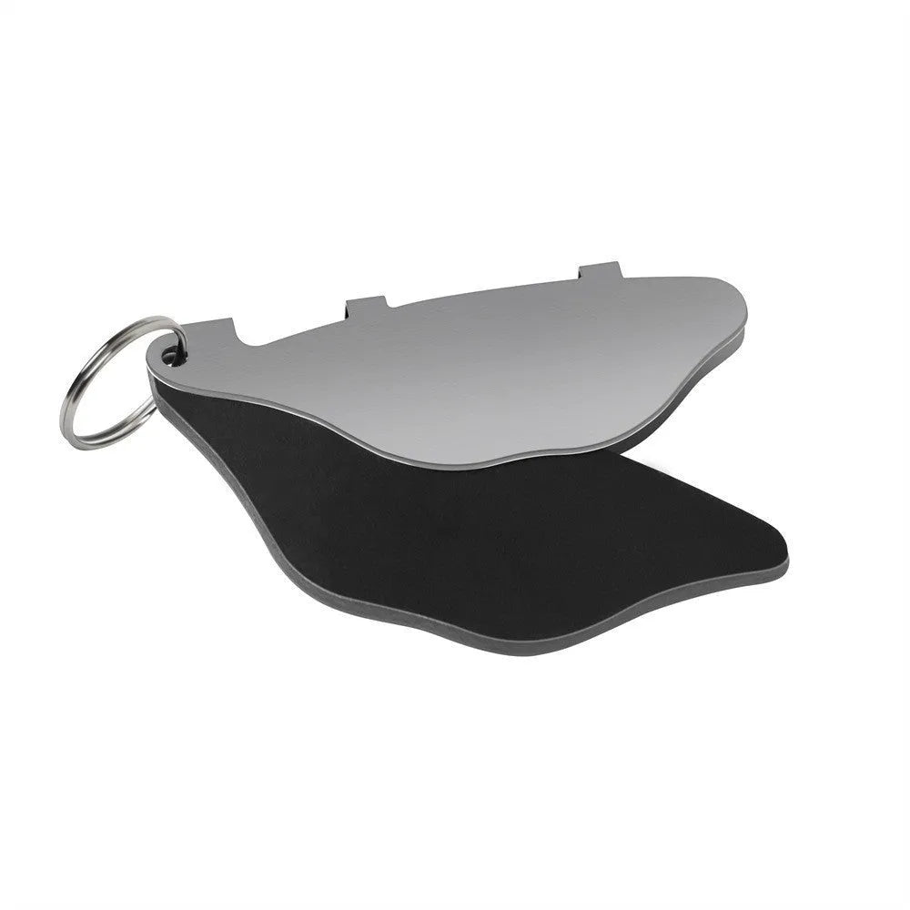 Mountain bike disc brake pads set showing metal linings and adjustment flap in black and orange colour options