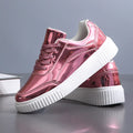 Gold sequinned platform sneaker with round toe and thick MD sole.