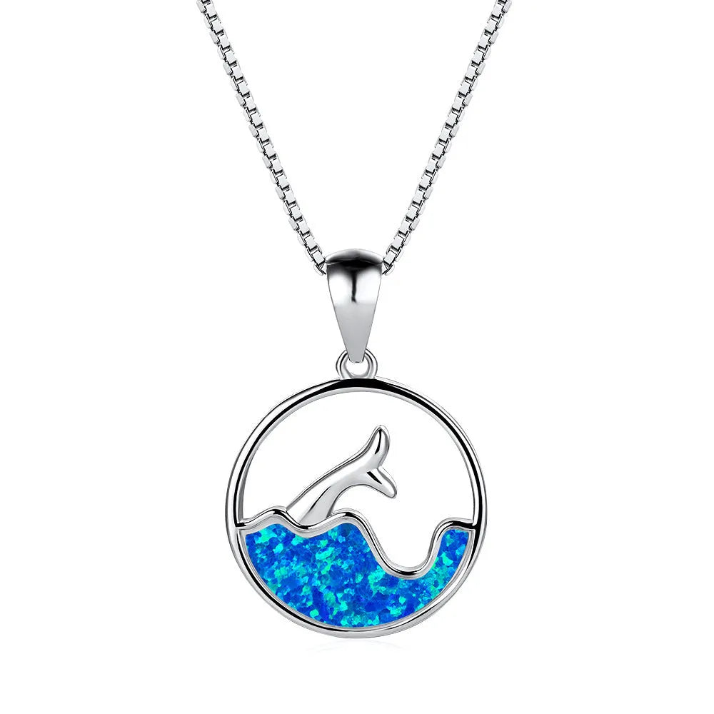 White gold electroplated necklace with a round geometric fishtail pendant in blue opal colour.
