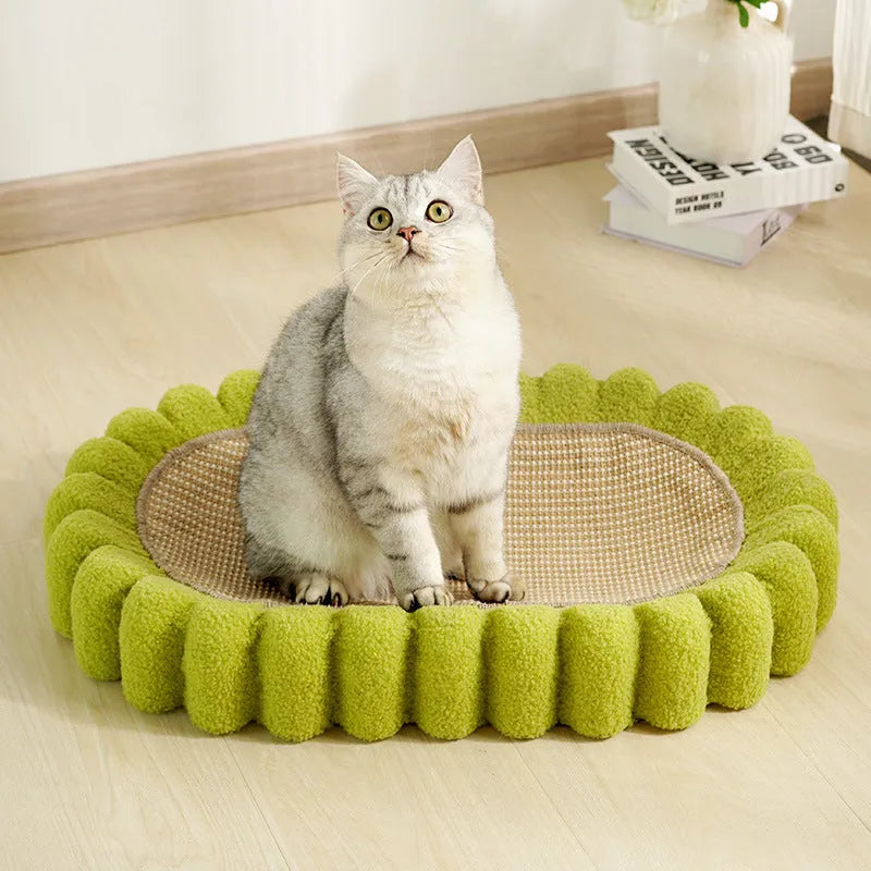 Green oval sisal cat scratching pad and bed measuring 650mm long