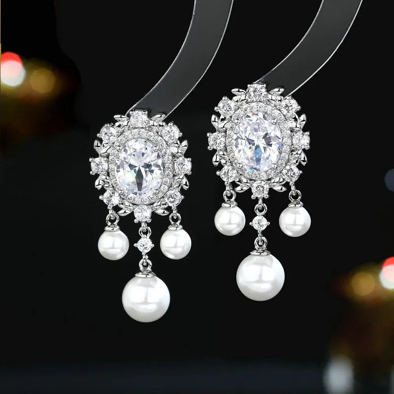 Oval geometric copper earrings with inlaid zircon stones and pearl tassel drops in light purple colour
