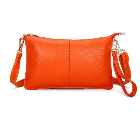 Lady cowhide slant bag in apricot showing top layer leather texture and dual straps