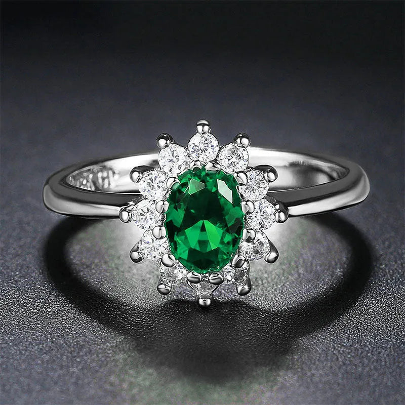 Women's copper floral ring with inlaid zirconium detail in green, blue, or red.