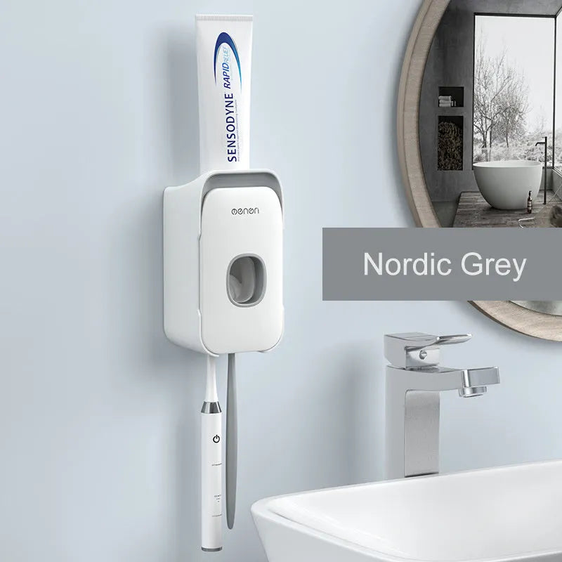 Automatic touchless toothpaste dispenser in blue colour mounted on a bathroom wall.