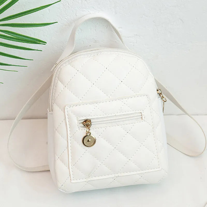 Girls' hard-shell vertical square backpack with embroidery in pink, showing front view and soft carry handle.