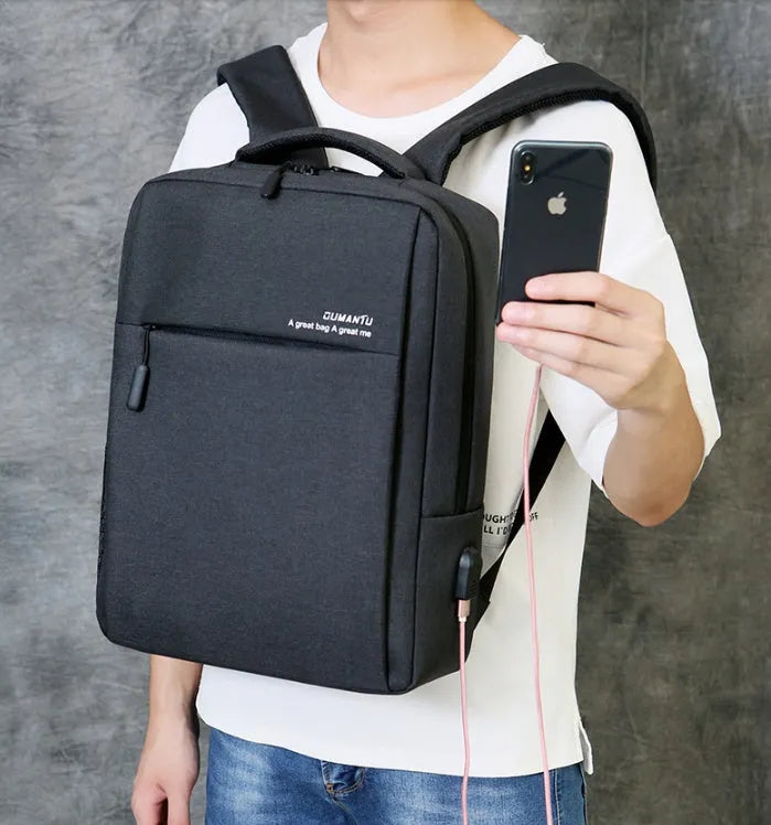 Black waterproof Oxford cloth laptop backpack with shoulder straps and built-in rechargeable power bank.