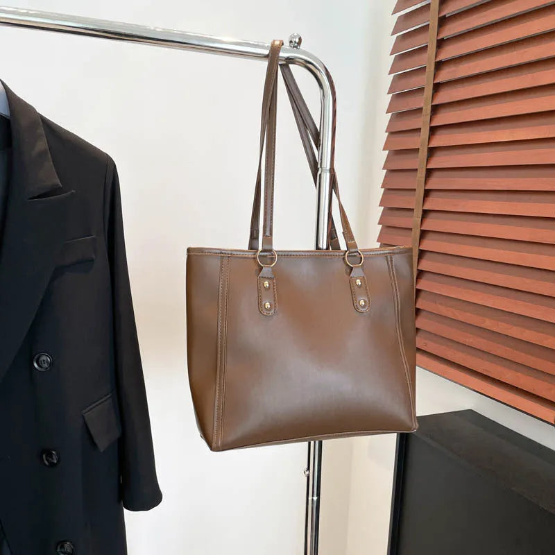 Square black PU underarm shoulder bag with a sandwich pocket design shown from the front.