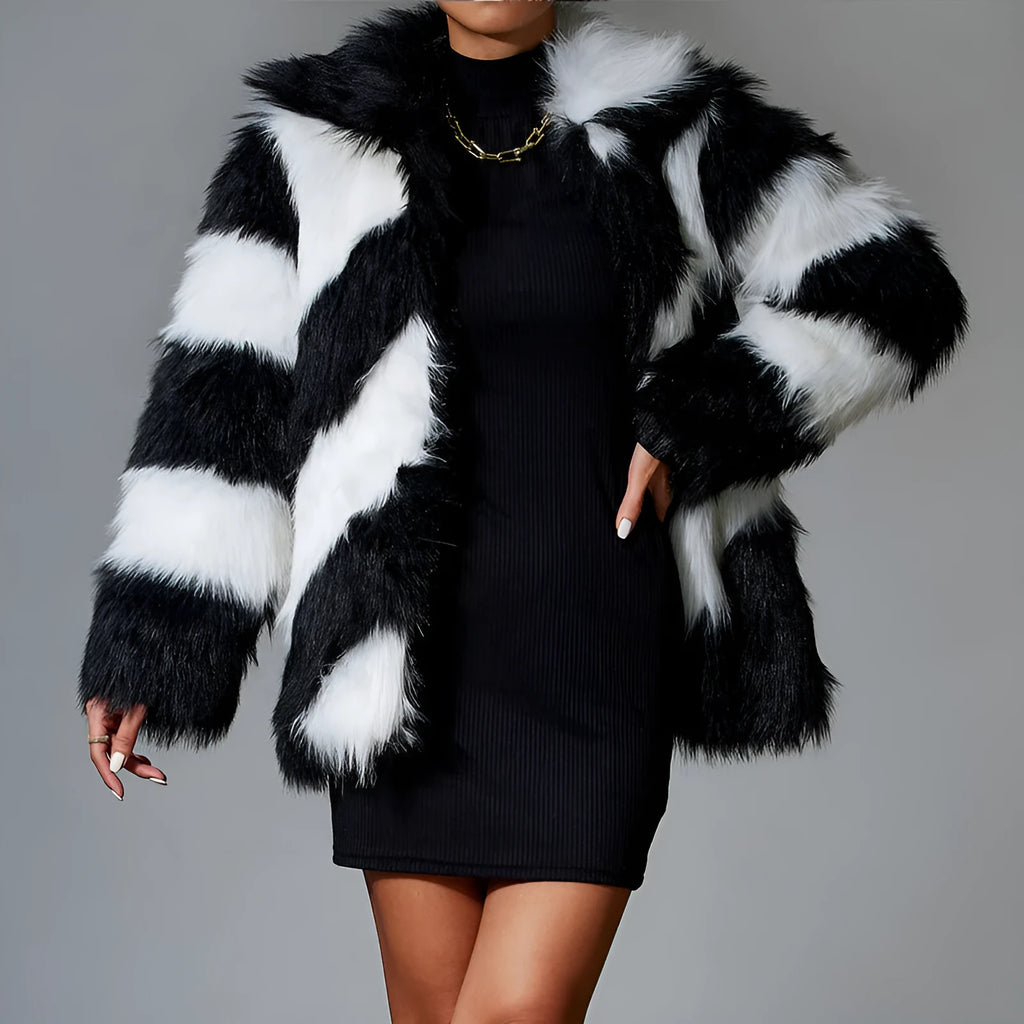 Minimalist women's faux fur coat with contrast colour lapel and a detachable fur collar.