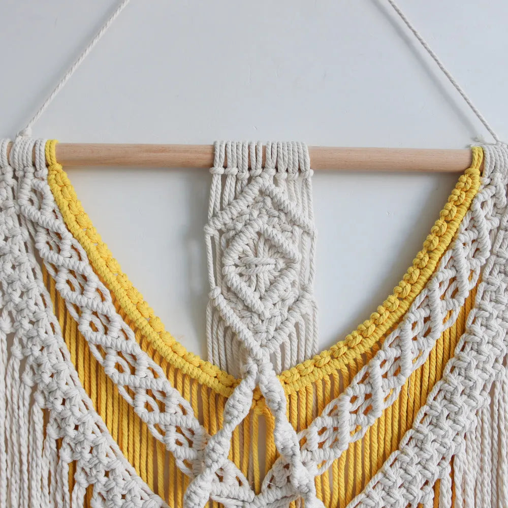 Hand-made cotton Nordic tapestry wall hanging in creamy white with yellow accents, 120cm by 95cm