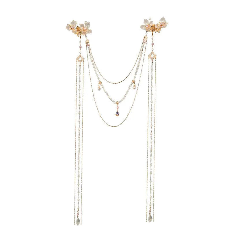 Gold women's hairpin with acrylic pearl, diamond flower decoration, and long dangling tassel.