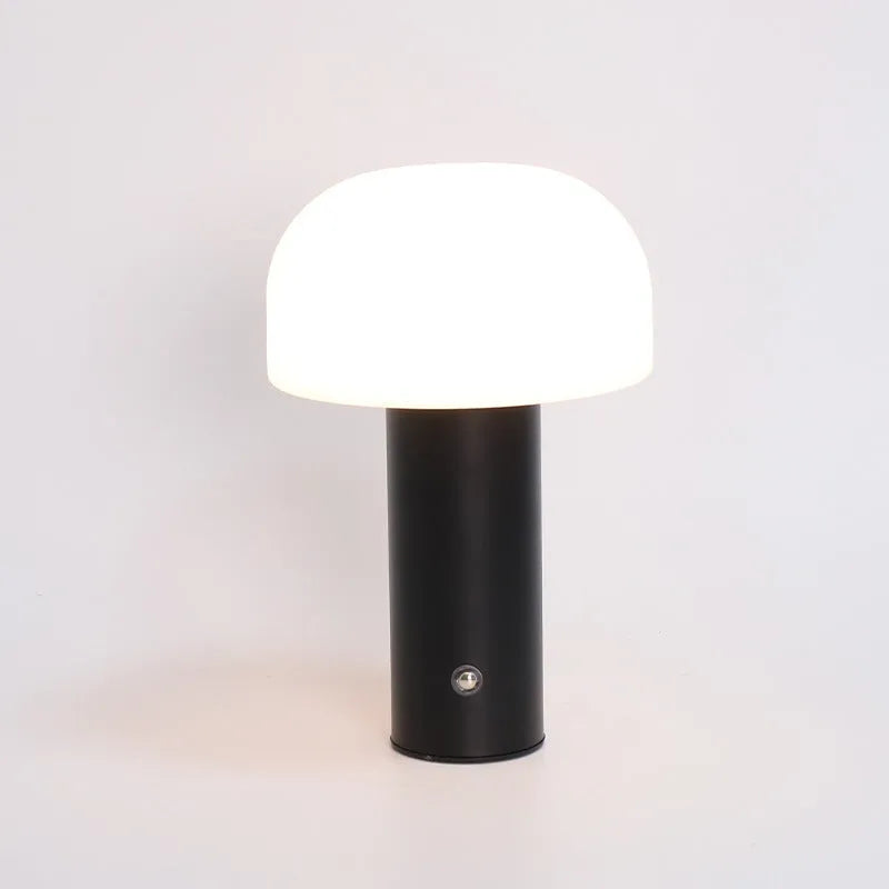 A USB-powered decorative table lamp in a choice of white, black, orange, or green colours.