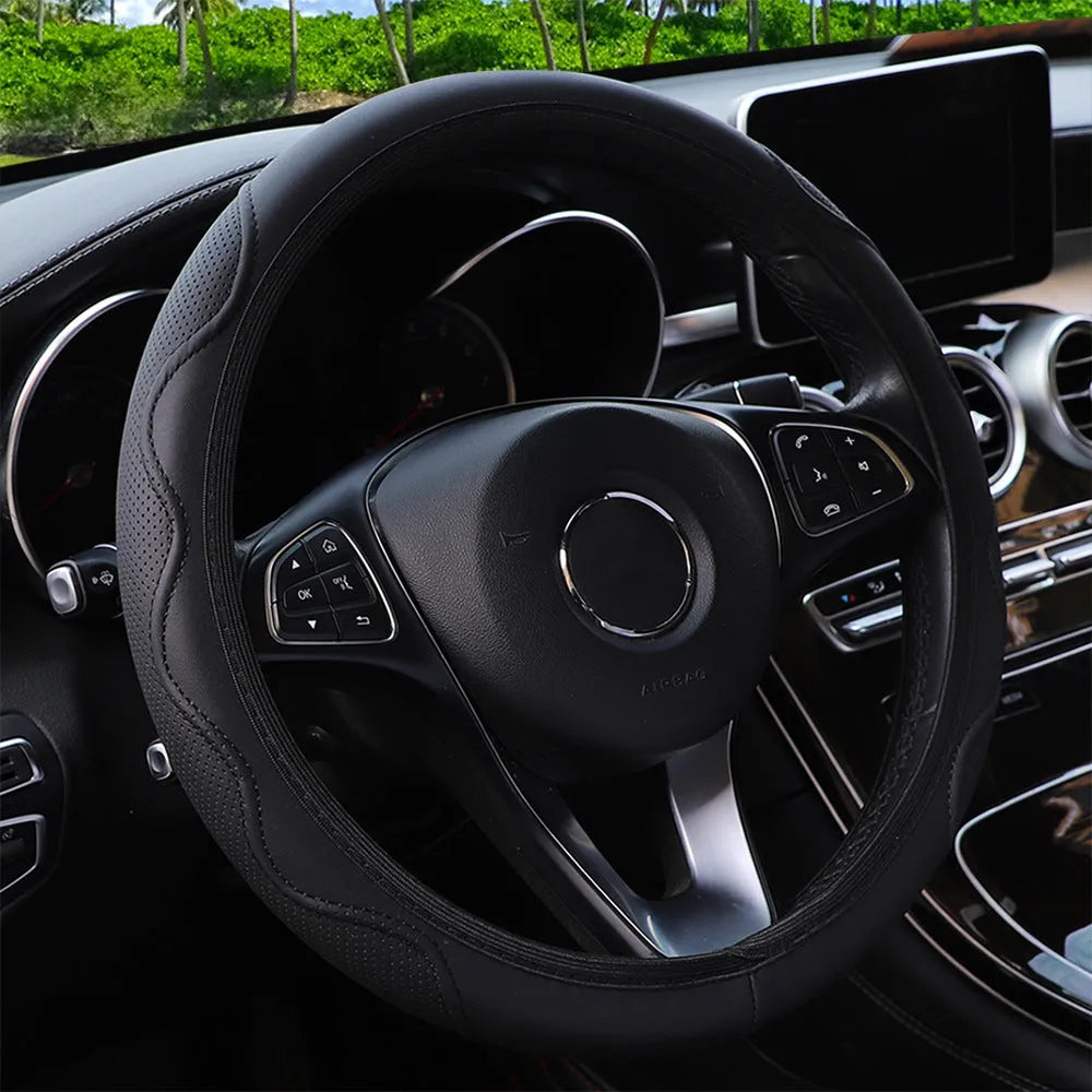 Black elastic steering wheel cover with a corrugated texture, stretched to show its fit.