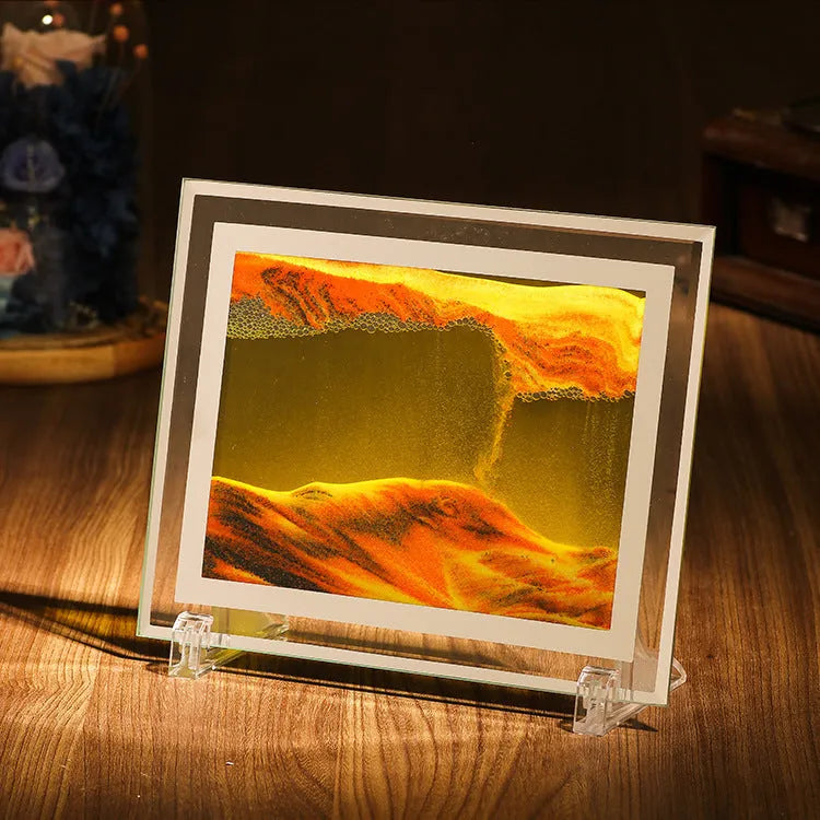 Glass quicksand painting ornament with geometric shape showing landscape sand art in black and white green colours.