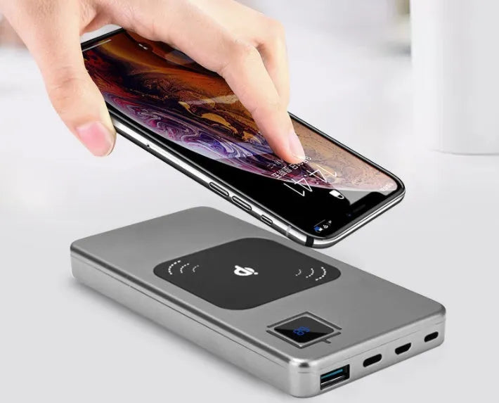 Silver alloy portable power bank with LCD display showing battery level, 10000mAh capacity.