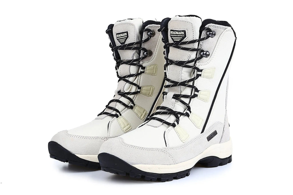 Women's black thermal snow boots with mid-calf height, round toe, and rubber sole.