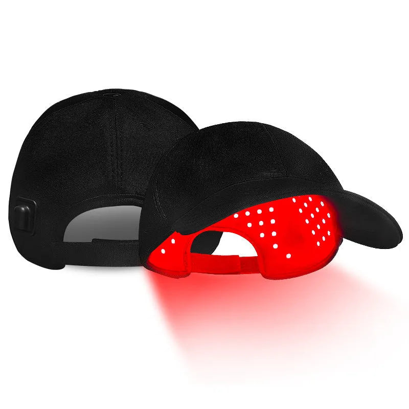 Black infrared peaked cap for hair growth with LED light strip and separate controller.