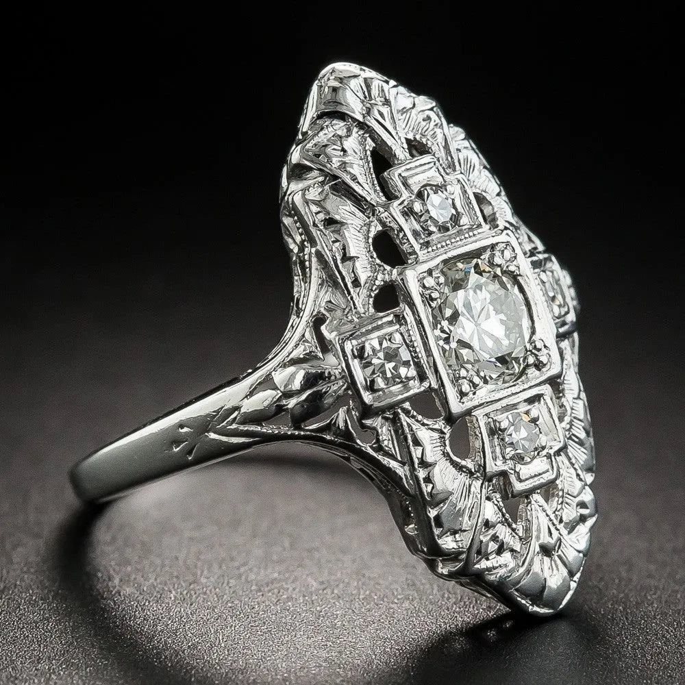 Silver hollow-out geometric ring with diamond-studded accents on copper base