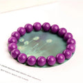 Genuine crystal bracelet with purple mica colour in a single circle design on a wrist.