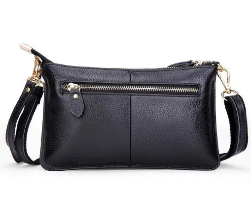 Lady cowhide slant bag in apricot showing top layer leather texture and dual straps