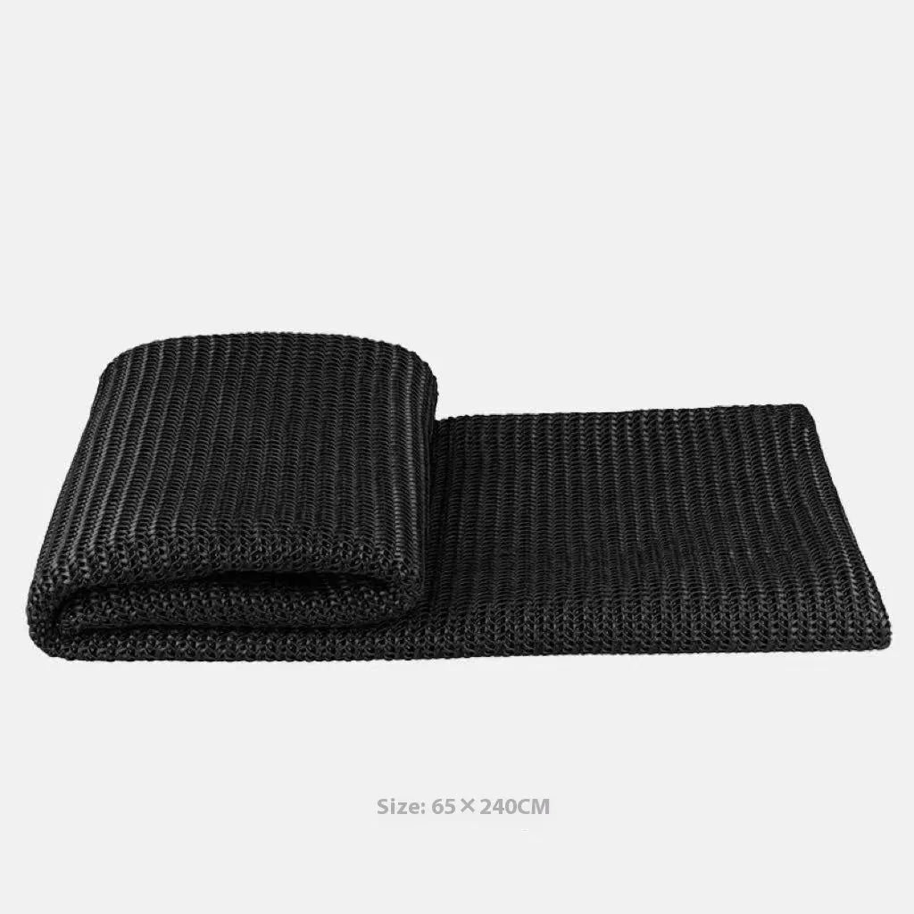 Modern minimalist grey and white plaid bed runner blanket set with matching pillow on a double bed