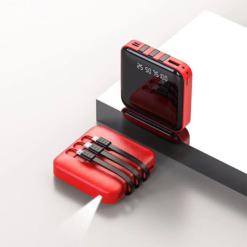 Black and red portable power bank with built-in charging cable, showing compact size