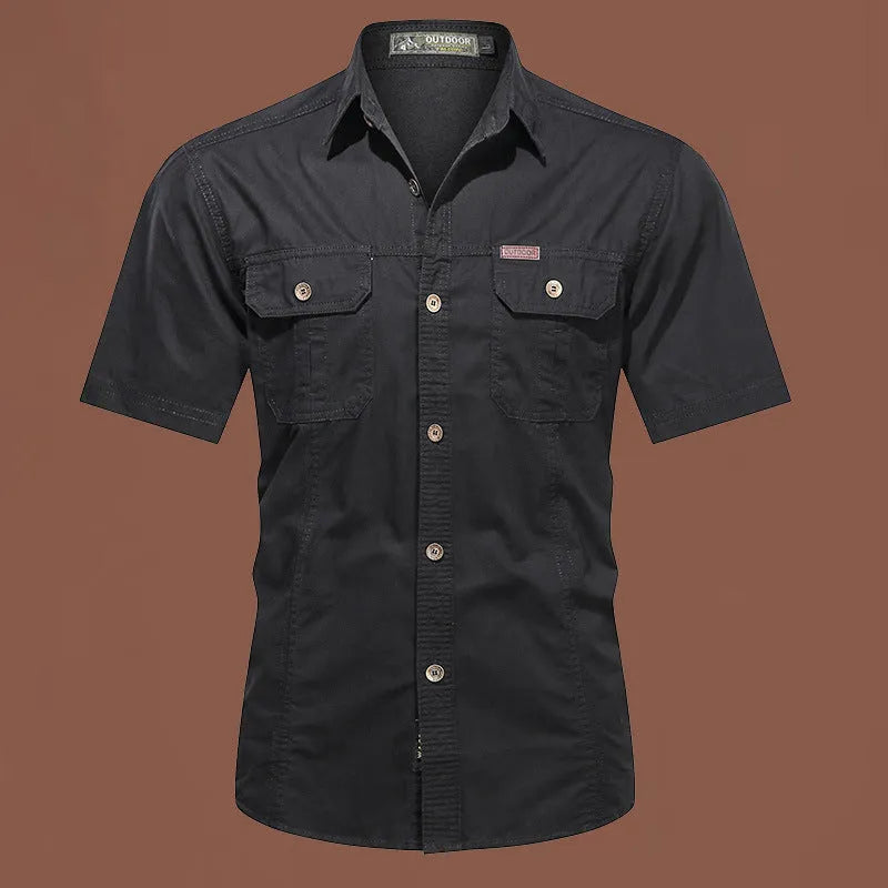 Men's loose-fitting short sleeve cotton work shirt in army green, laid flat.