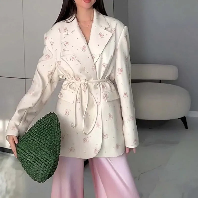 Women's white suit jacket with lace-up waist detail and regular long sleeves