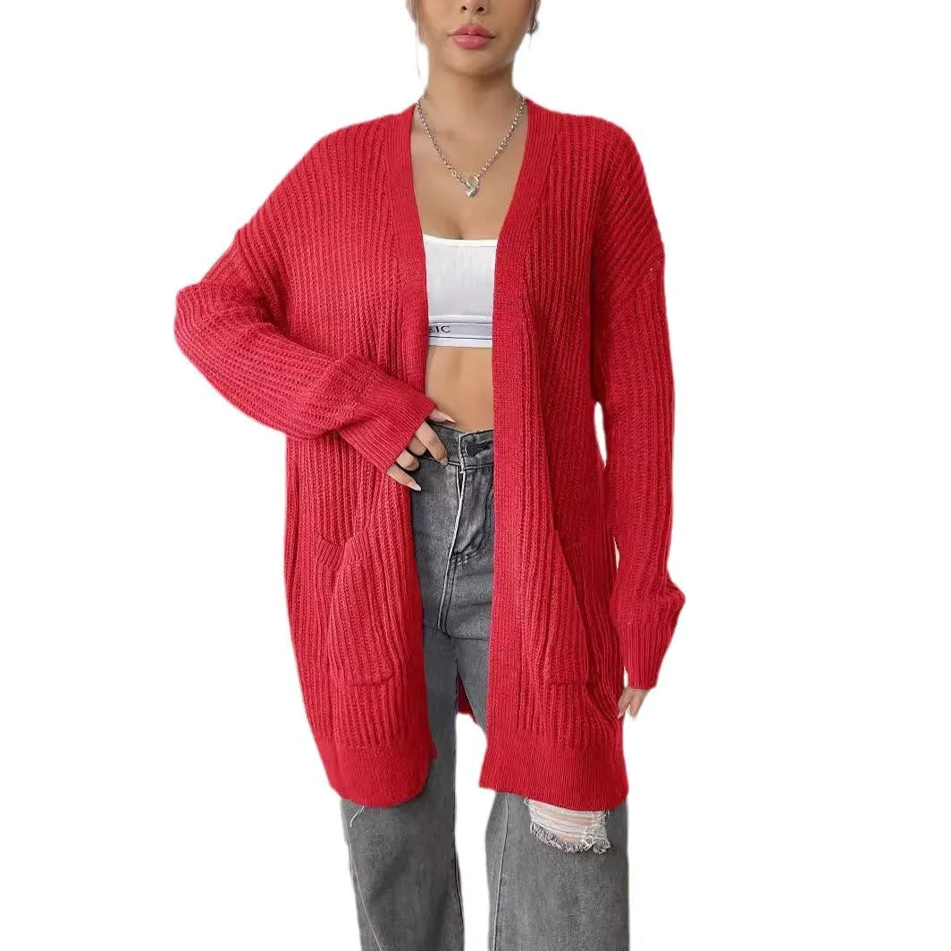Women's dark green two-pocket acrylic cardigan sweater with loose fit and long sleeves