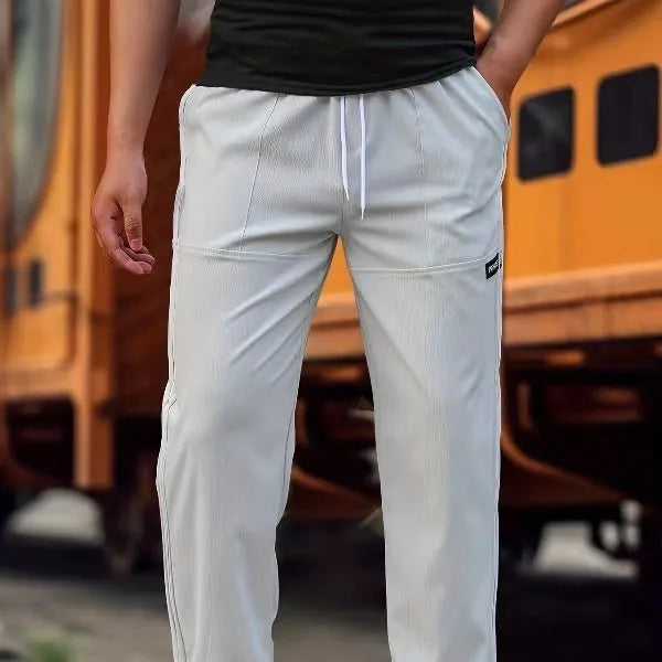Men's polyester trousers for spring and autumn in light grey, available in sizes S to XXXL.