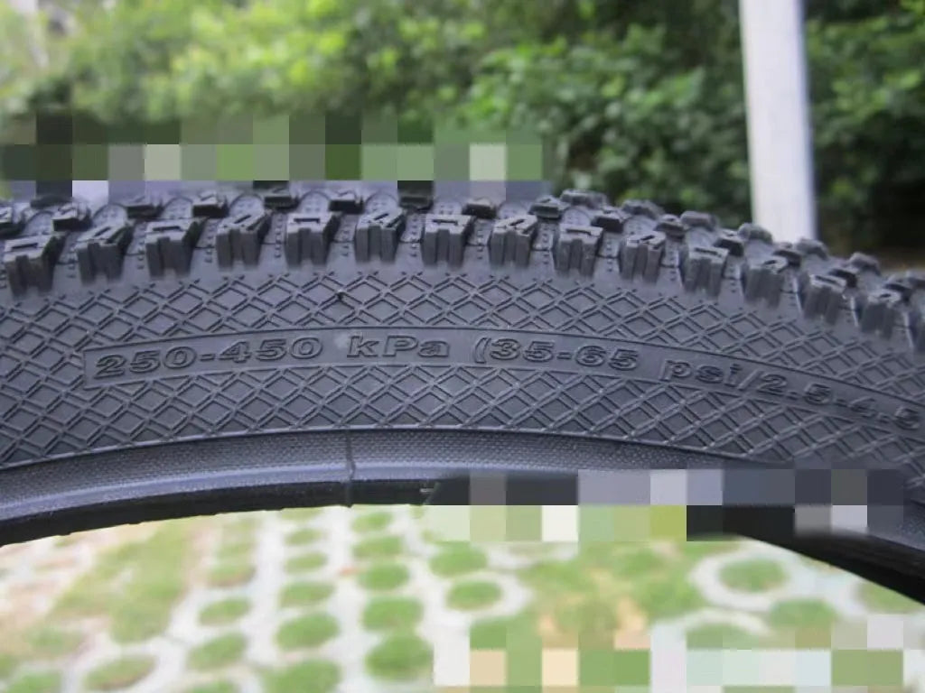 Mountain bike tyre with puncture-proof construction, shown in multiple sizes including 26x1.95 and 27.5x2.1