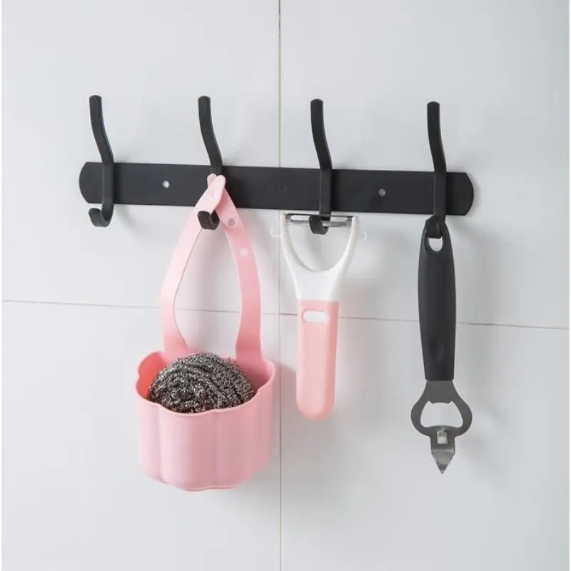 Plastic sink drain basket in Nordic style, shown in dark blue, measuring 20 cm long by 10 cm wide.