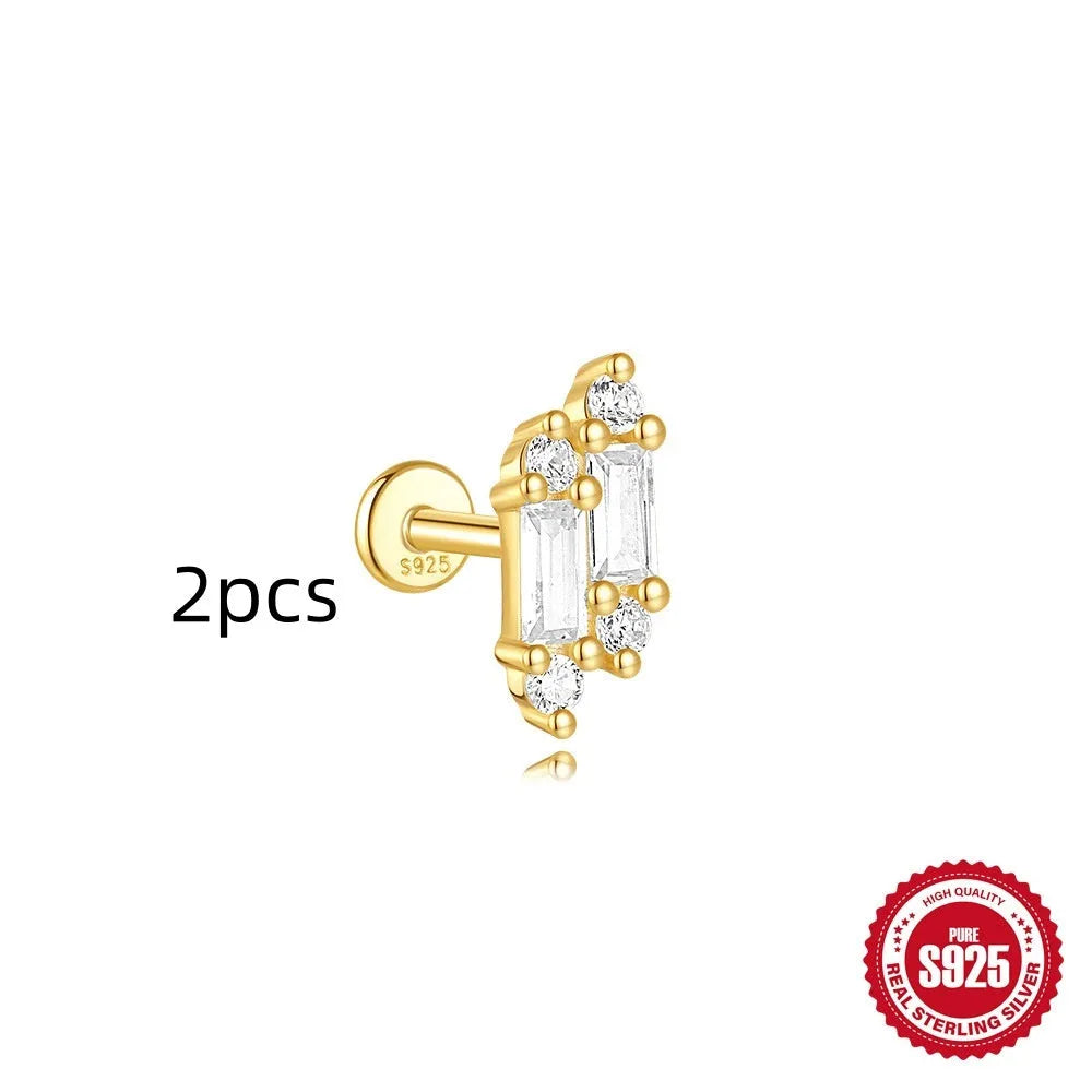 Geometric kite-shaped sterling silver earrings with a gold electroplated chain tassel featuring rhinestones.