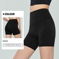 Women's high waist Lycra yoga shorts in leaf green, shown in a yoga pose.