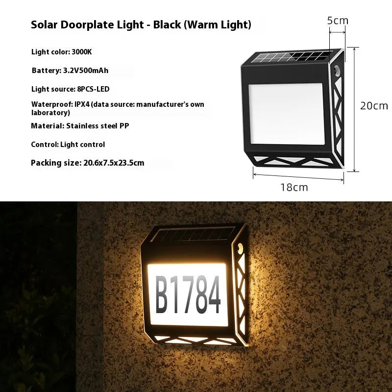 Black solar-powered doorplate light with LED illumination for house numbers measuring 180x50x200mm