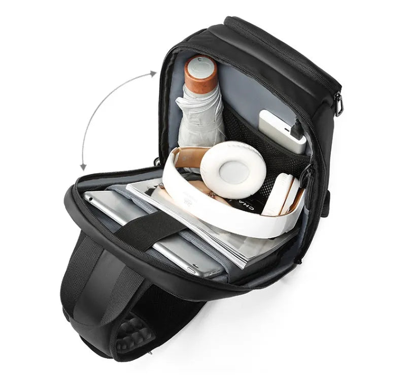 Black PVC outdoor shoulder bag showing internal organisation compartments and air cushion strap