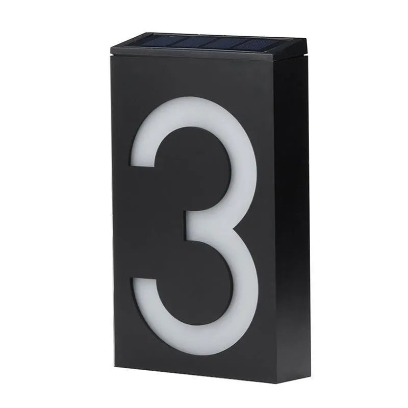 Solar powered white LED house number light mounted on a wall with IP65 waterproof rating
