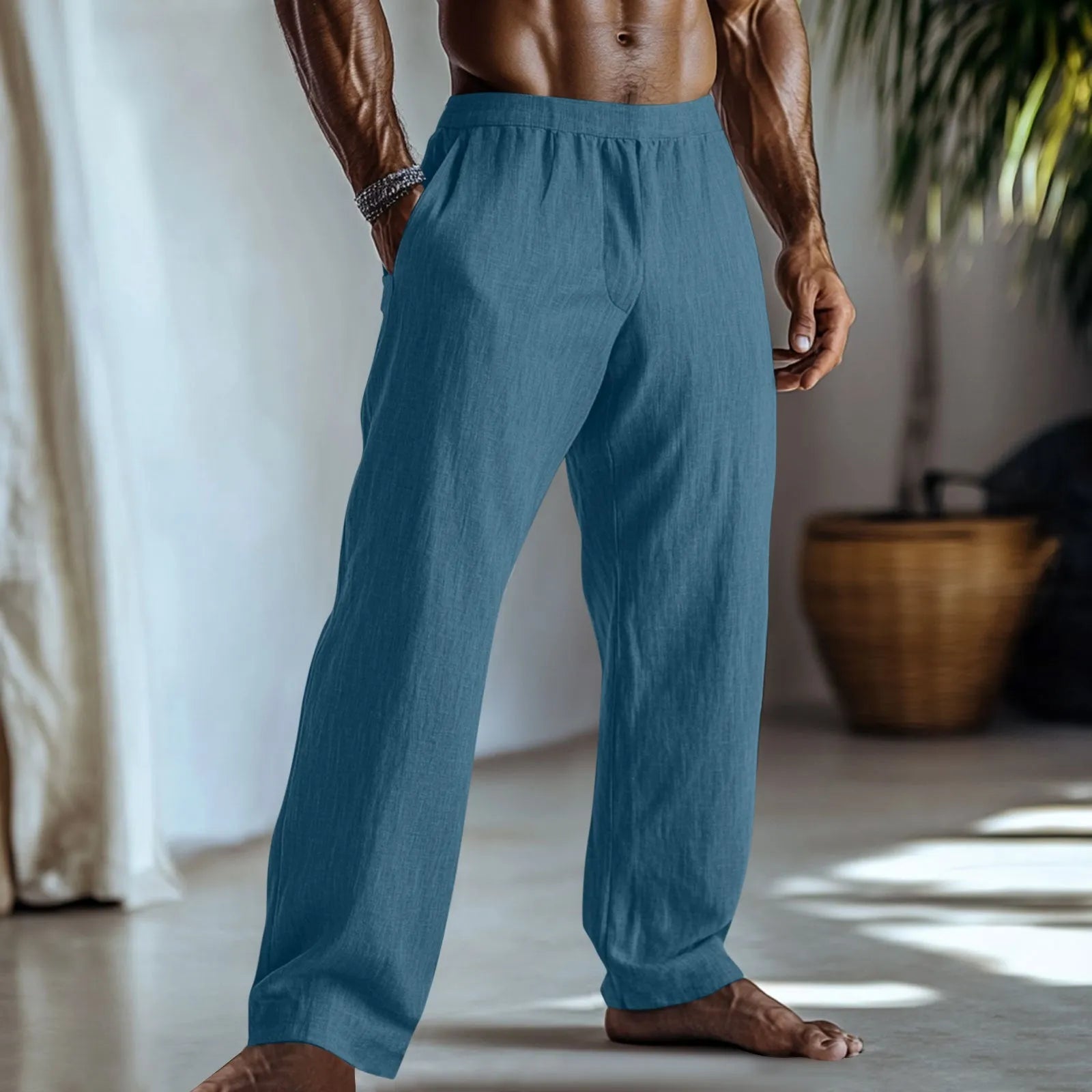 Straight-leg cotton and linen casual trousers in light green colour with visible pockets.