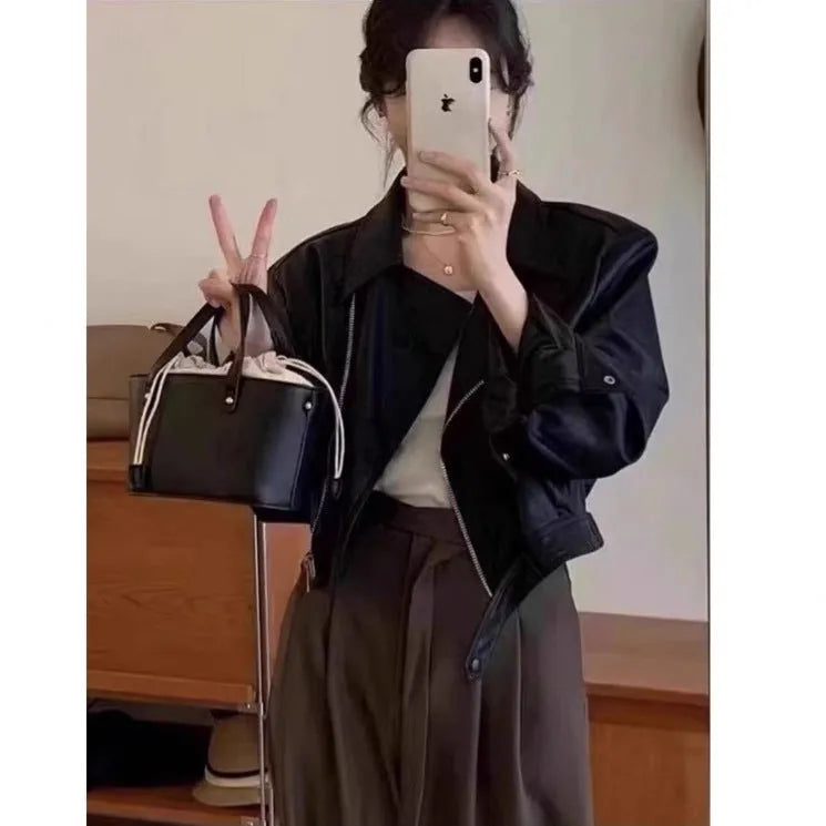 Brown women's retro slim-fit leather coat jacket with long sleeves and pockets.