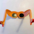 Orange plastic sunglasses with a personality leg and hip design.