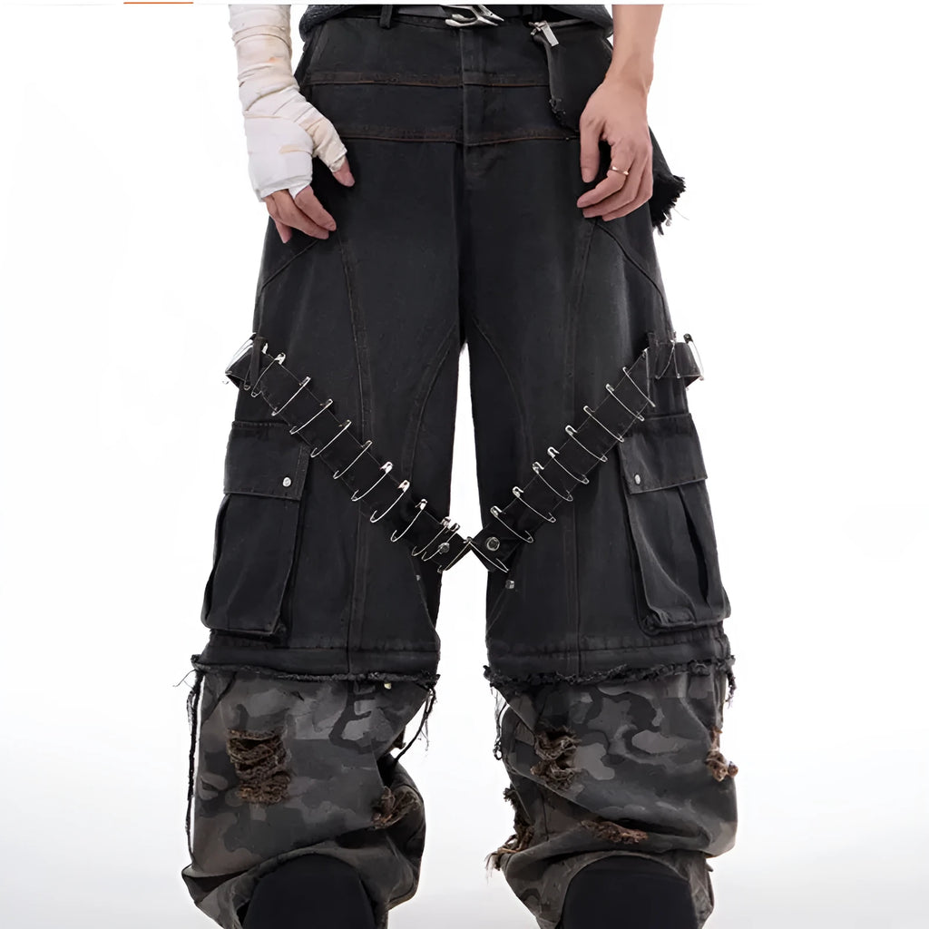 Men's grey camouflage jeans with splicing panel design and decorative pin and ribbon details
